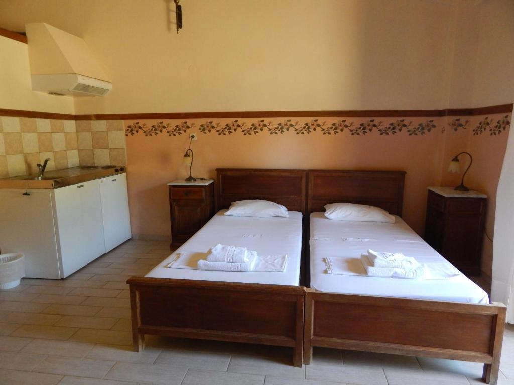 Postel nebo postele na pokoji v ubytování Ktima Holoway Apartments