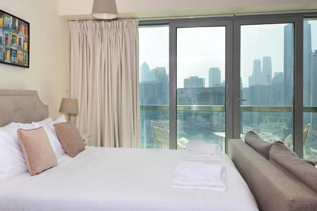 Postel nebo postele na pokoji v ubytování Prime Retreats - Downtown Dubai