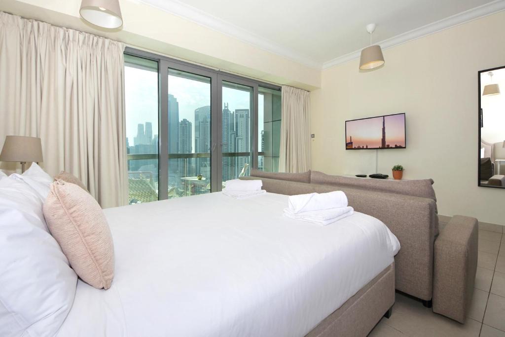 Postel nebo postele na pokoji v ubytování Prime Retreats - Downtown Dubai