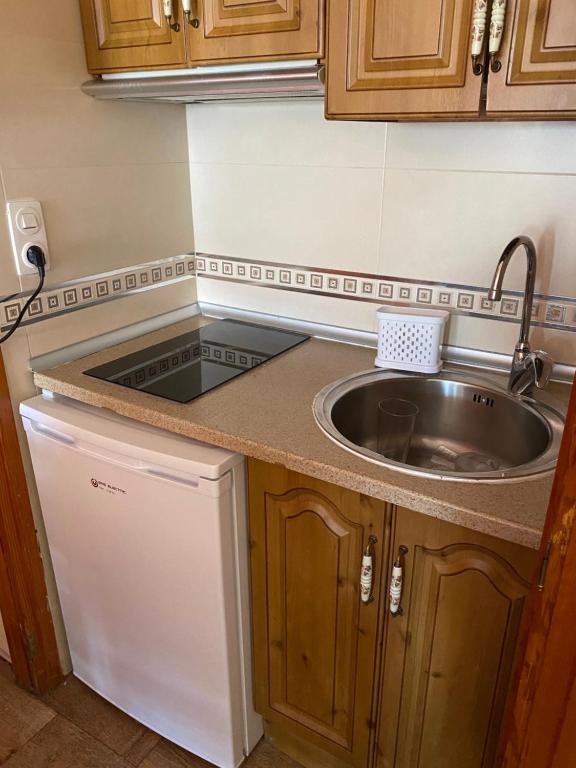 Kuchyň nebo kuchyňský kout v ubytování Rebeca Rooms