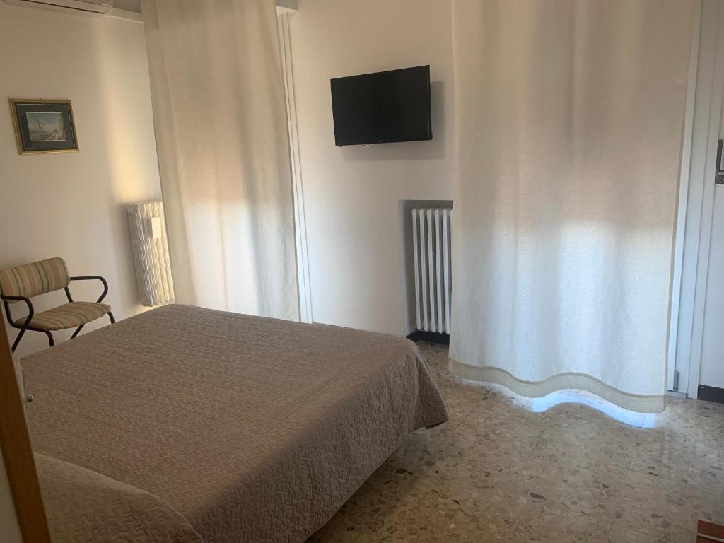 Postel nebo postele na pokoji v ubytování Hotel Marchina