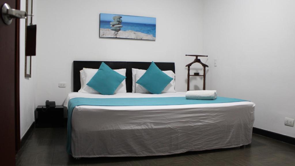 Postel nebo postele na pokoji v ubytování Hotel Los Cristales