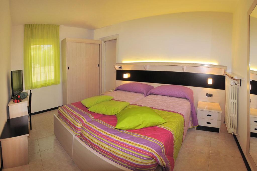 Postel nebo postele na pokoji v ubytování Albergo Alla Torre