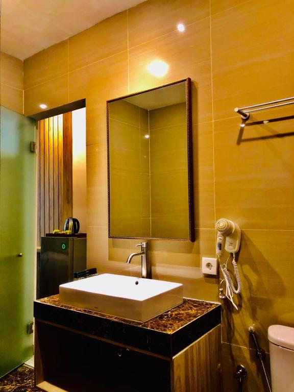 Koupelna v ubytování Graha Socio Hotel Nusa Dua Bali