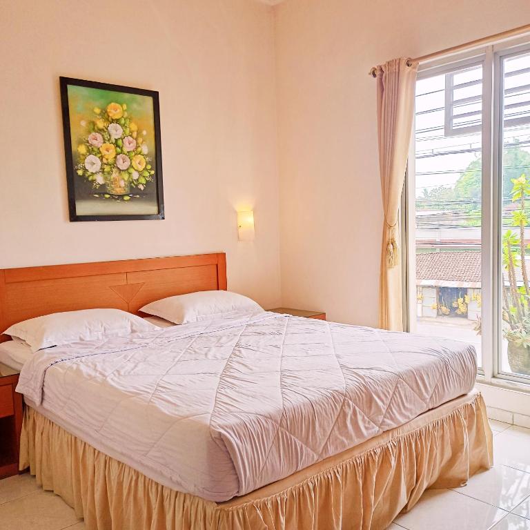 Postel nebo postele na pokoji v ubytování Hotel Flamboyan