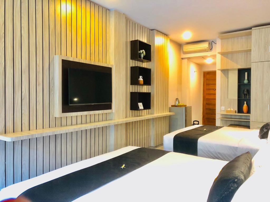 Postel nebo postele na pokoji v ubytování Graha Socio Hotel Nusa Dua Bali