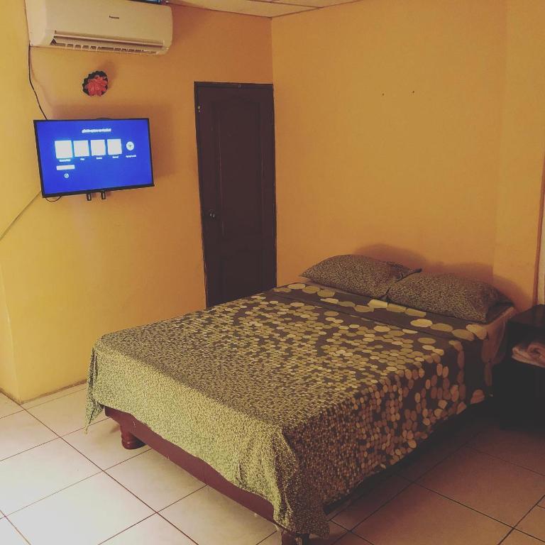 Postel nebo postele na pokoji v ubytování Funky Monkey