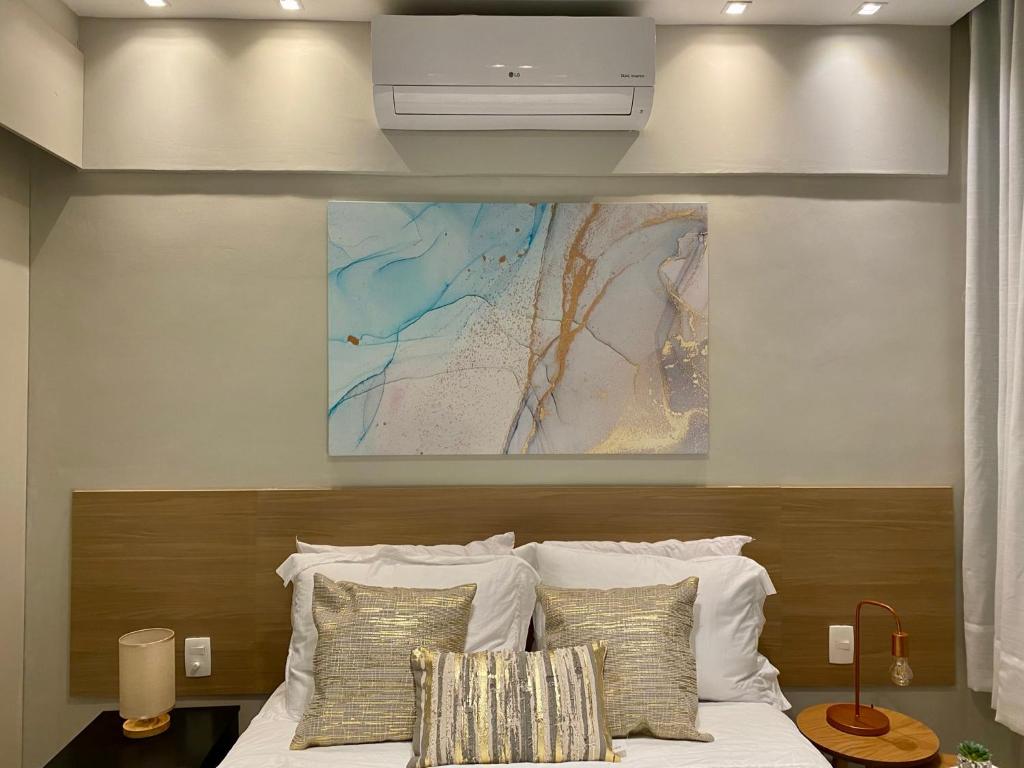 a bedroom with a bed with a map on the wall at Apartment Ipanema Arpoador - 300m da praia in Rio de Janeiro