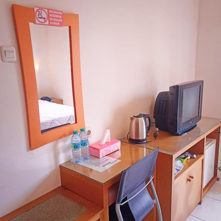 TV a/nebo společenská místnost v ubytování Hotel Flamboyan