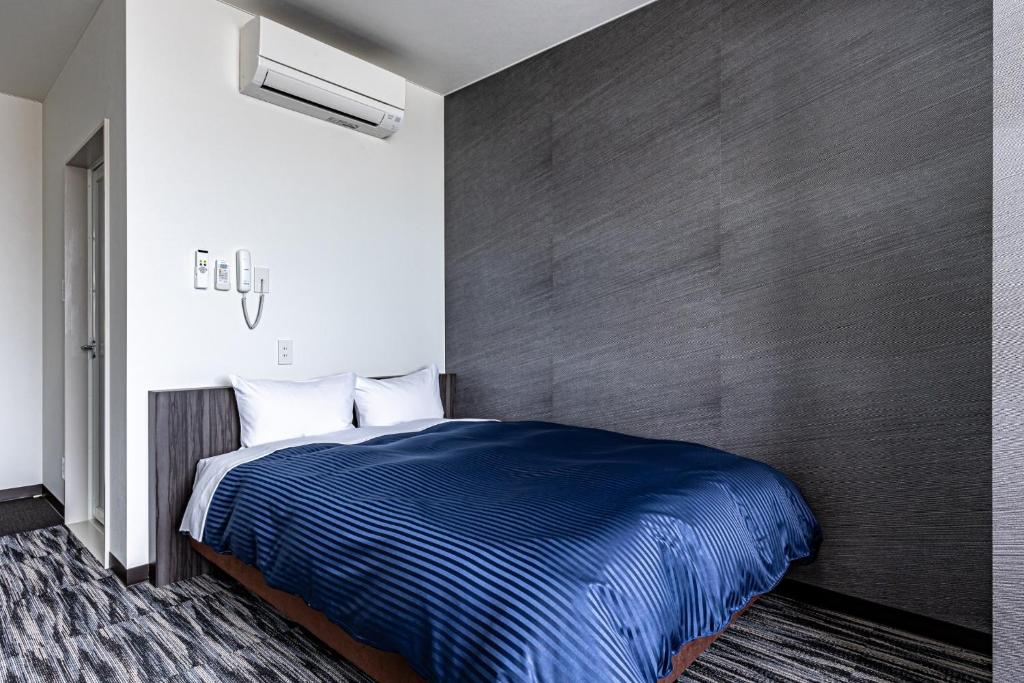 Un pat sau paturi într-o cameră la SAIDAIJI GRAND HOTEL - Vacation STAY 67893v