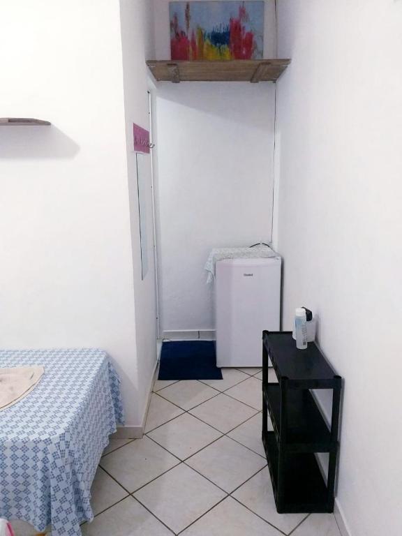 Postel nebo postele na pokoji v ubytování SUITES COR DO SOL TRINDADE