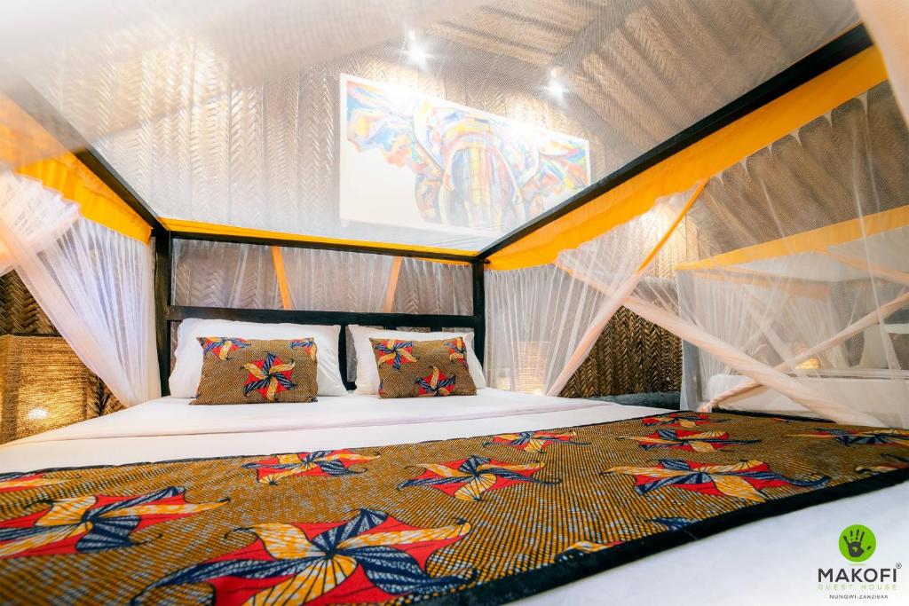 a bedroom with a bed in a tent at Makofi Guest House in Nungwi