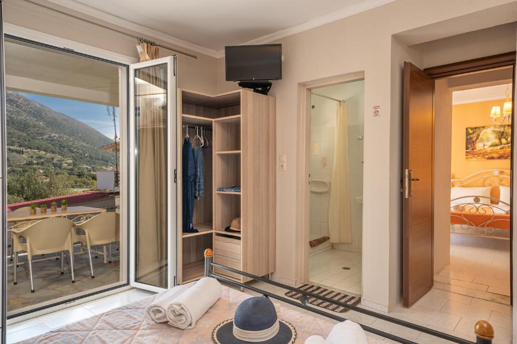 a living room with a view of a bedroom at Minas Apartments in Divarata
