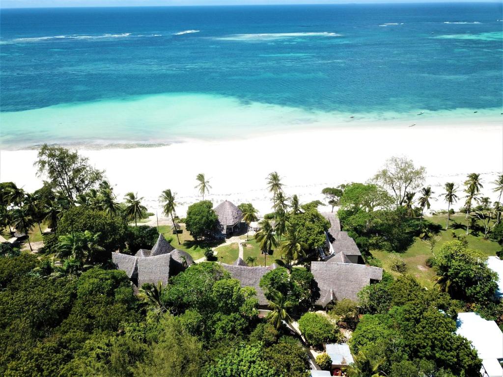 an aerial view of a resort and the beach at Eleven Pearl Boutique Hotel & Spa in Diani Beach