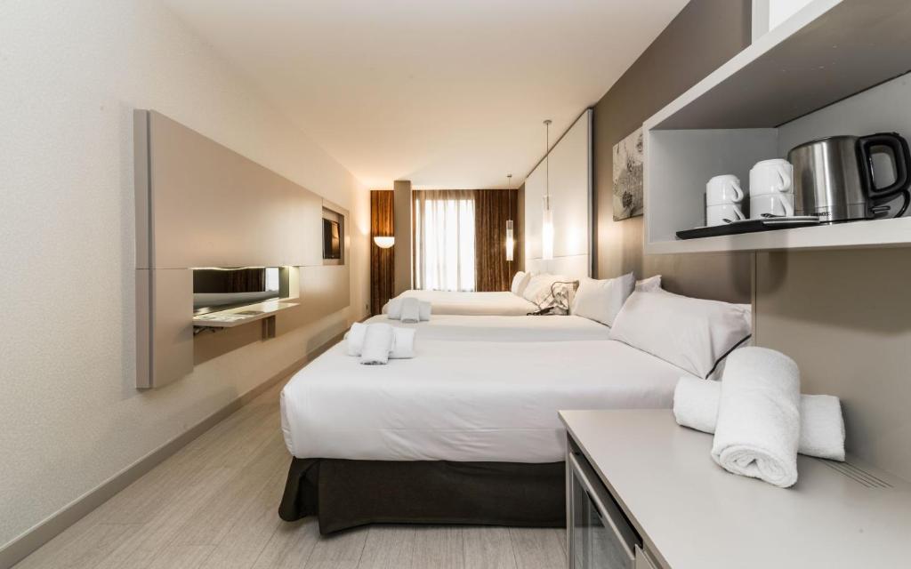 Postel nebo postele na pokoji v ubytování Grums Hotel & Spa
