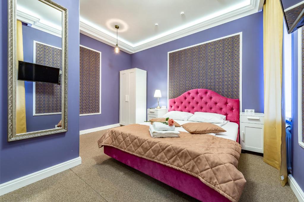 Ένα ή περισσότερα κρεβάτια σε δωμάτιο στο Boutique-Hotel George