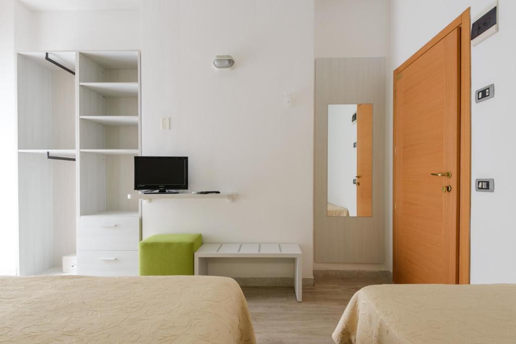 Postel nebo postele na pokoji v ubytování Hotel Clipper
