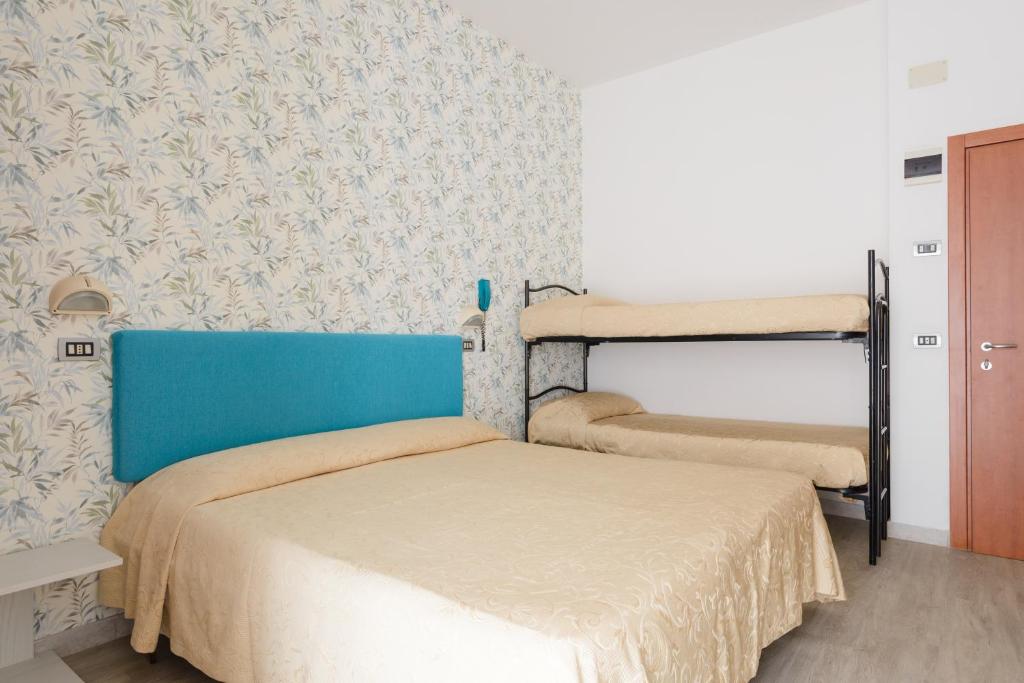 Postel nebo postele na pokoji v ubytování Hotel Clipper