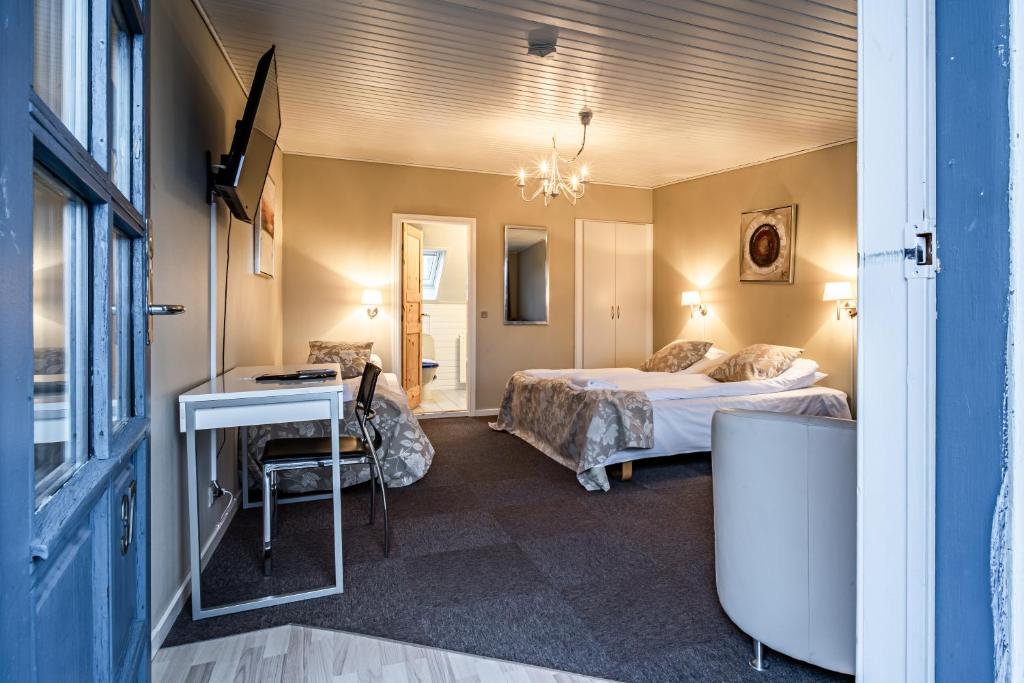 Postel nebo postele na pokoji v ubytování Hotel Allinge