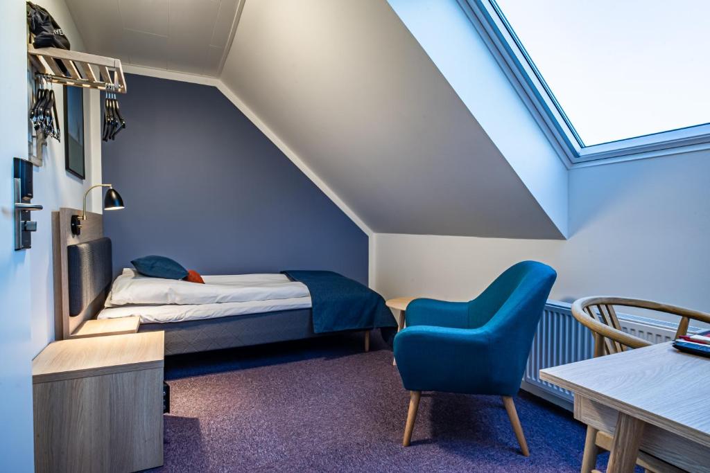 Postel nebo postele na pokoji v ubytování Hotel Allinge