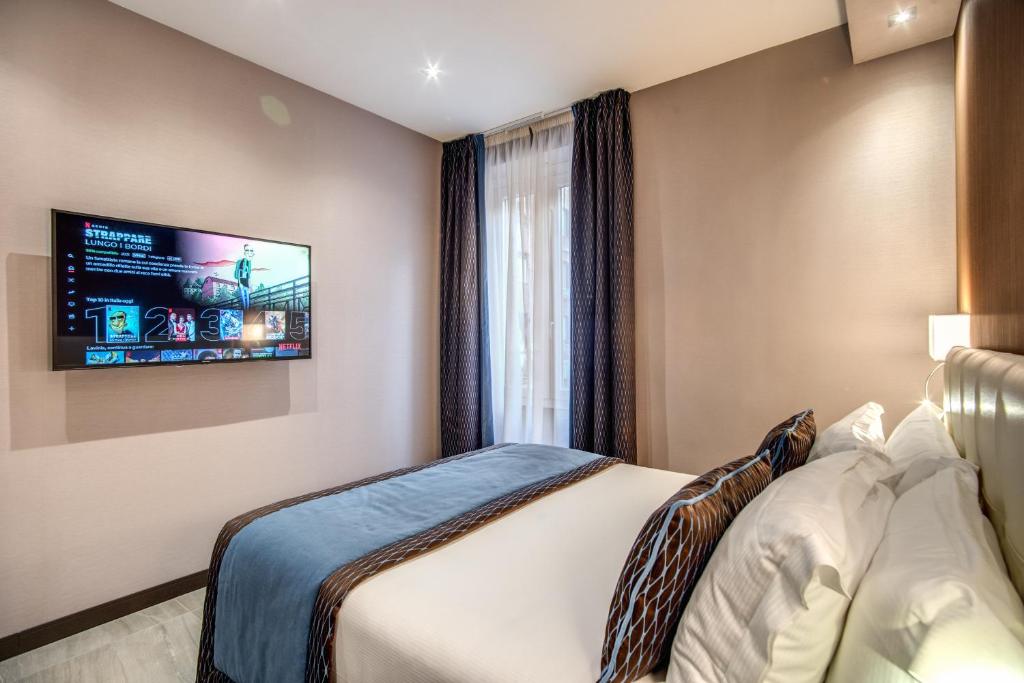 Postel nebo postele na pokoji v ubytování MZ HOTEL