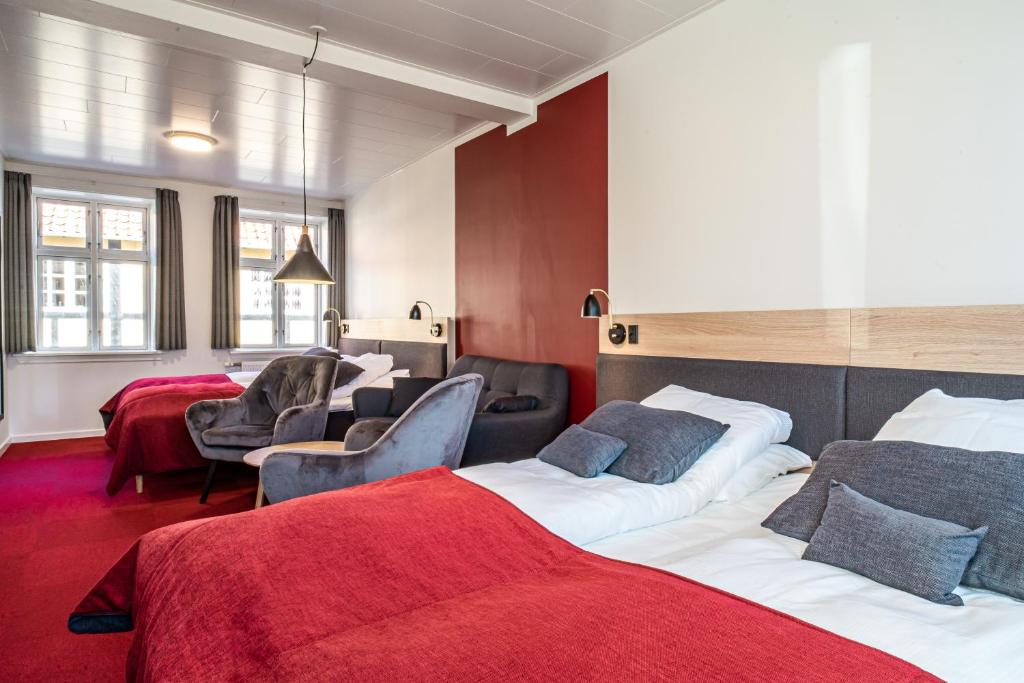 Postel nebo postele na pokoji v ubytování Hotel Allinge