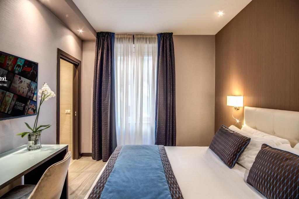 Postel nebo postele na pokoji v ubytování MZ HOTEL