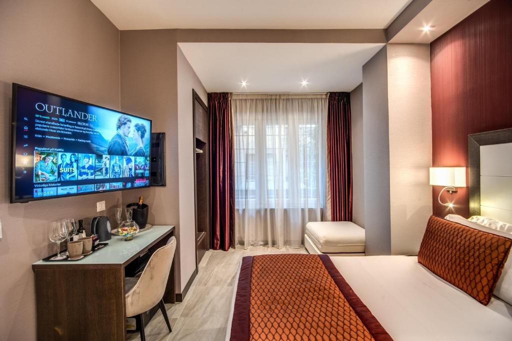 TV a/nebo společenská místnost v ubytování MZ HOTEL