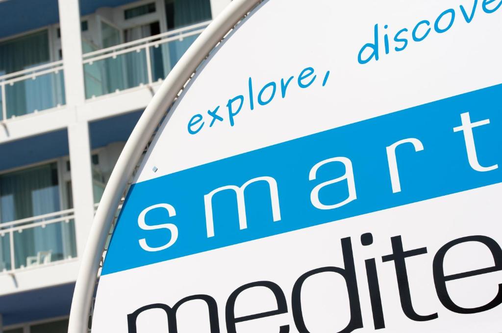 a sign in front of a building at Hotel Mediterraneo in Sottomarina