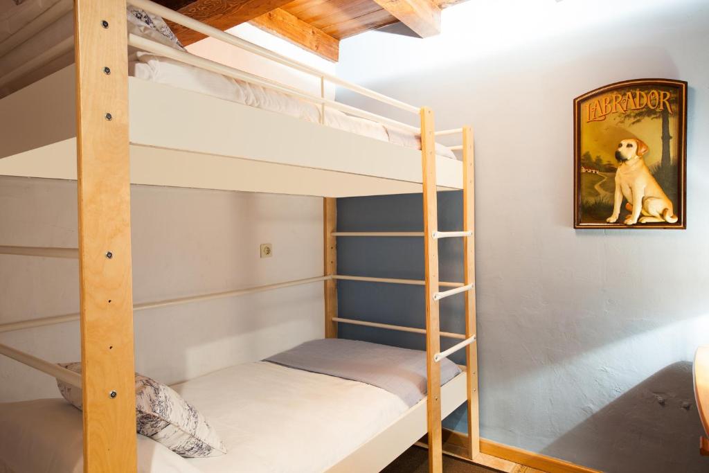 Postel nebo postele na pokoji v ubytování Tarter Chalets Apartaments