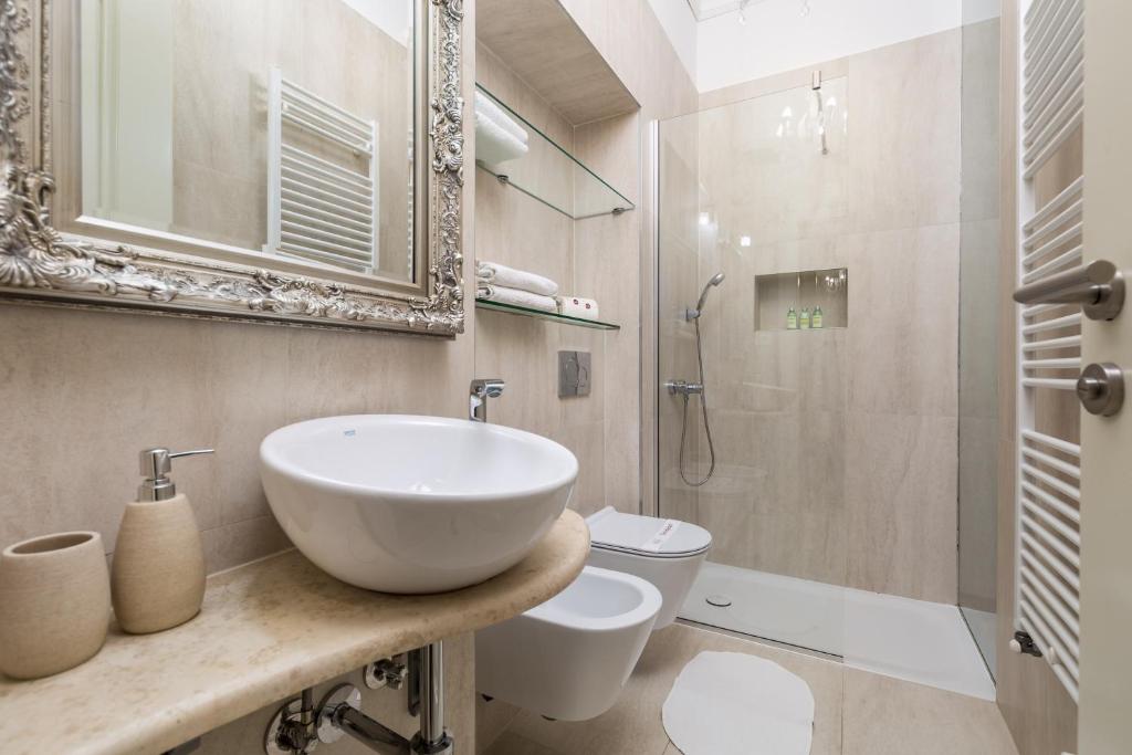 a bathroom with a sink and a toilet and a shower at Villa Sokol Apartments Opatija center in Opatija