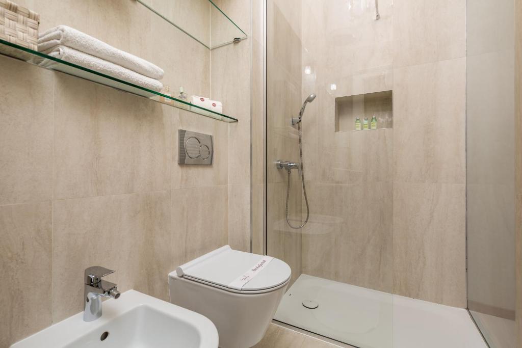 a bathroom with a shower and a toilet and a sink at Villa Sokol Apartments Opatija center in Opatija