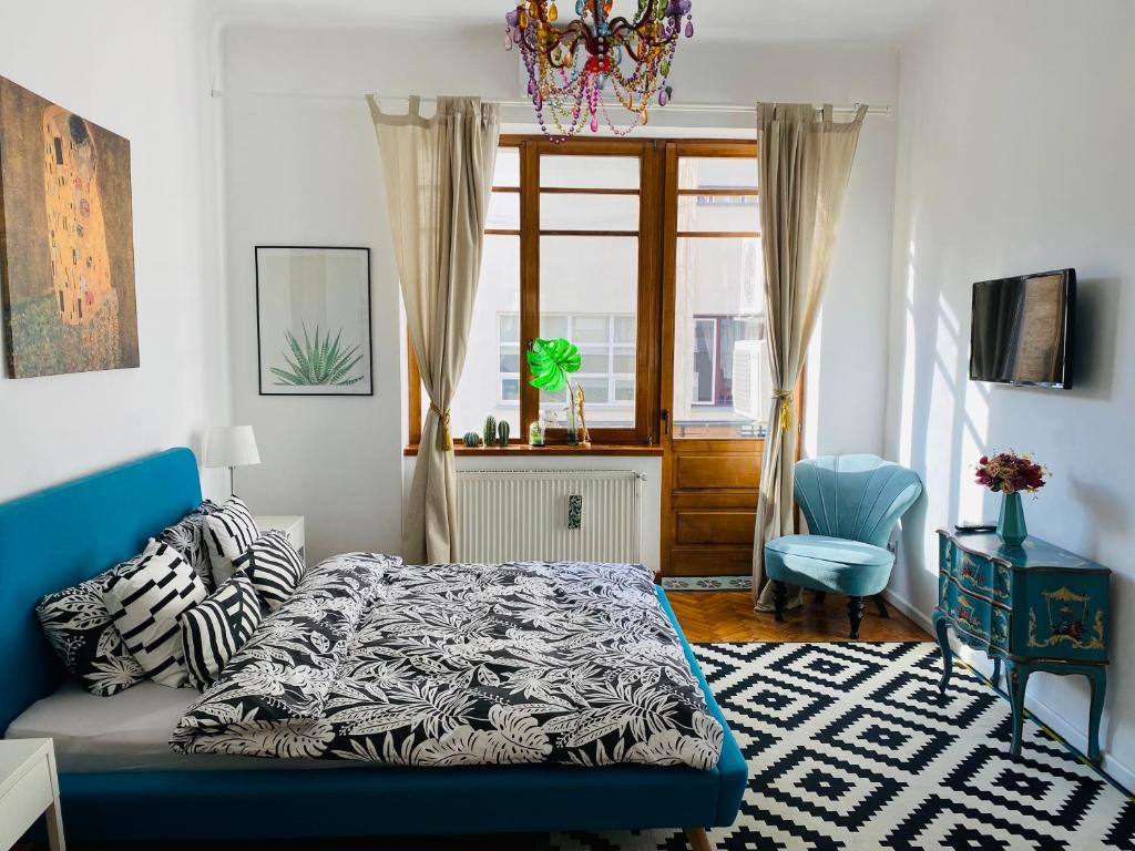 Un pat sau paturi într-o cameră la Andrea Apartments