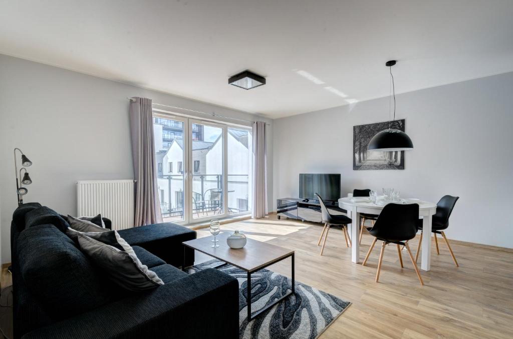 Telewizja i/lub zestaw kina domowego w obiekcie Dom & House - Apartments Chmielna Park