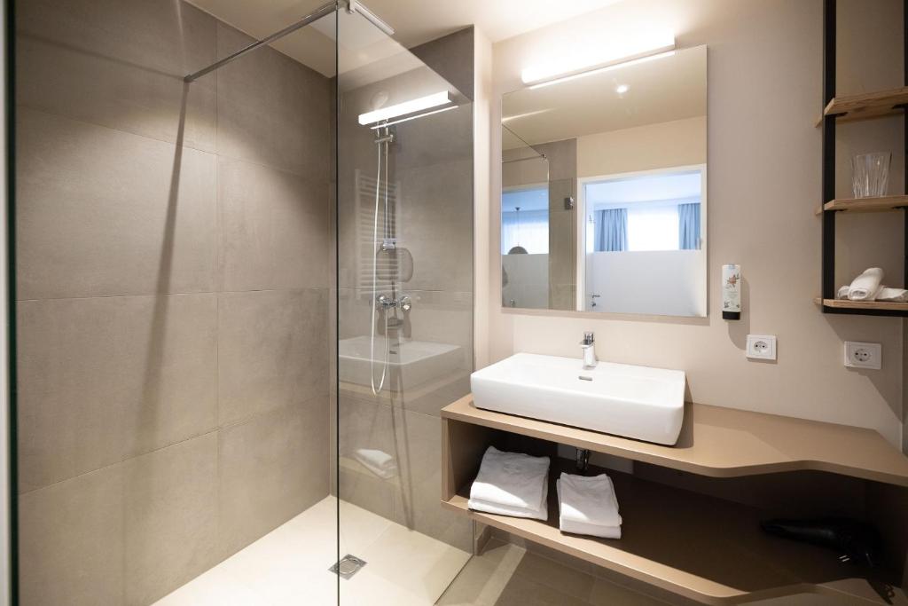Koupelna v ubytování ALPRIMA Aparthotel Hinterstoder
