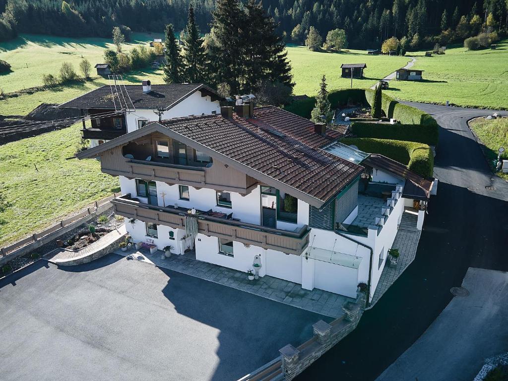 an overhead view of a large house with a lake at Auszeit-Oetztal in Sautens
