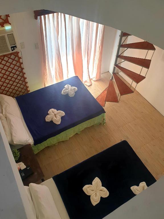 Postel nebo postele na pokoji v ubytování Pagudpud Rinnovati
