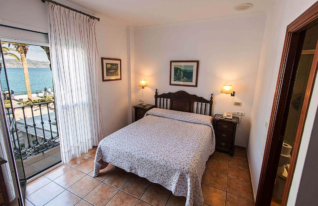 Postel nebo postele na pokoji v ubytování Hostal Marissal by Dorobe