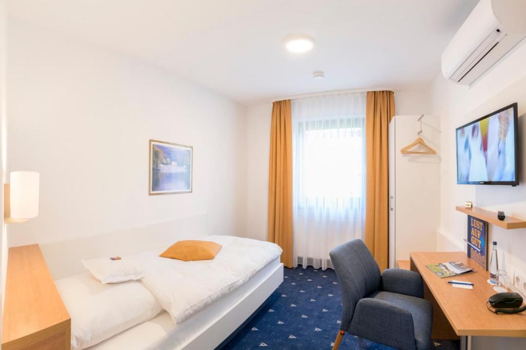 TV a/nebo společenská místnost v ubytování Hotel Adler Post