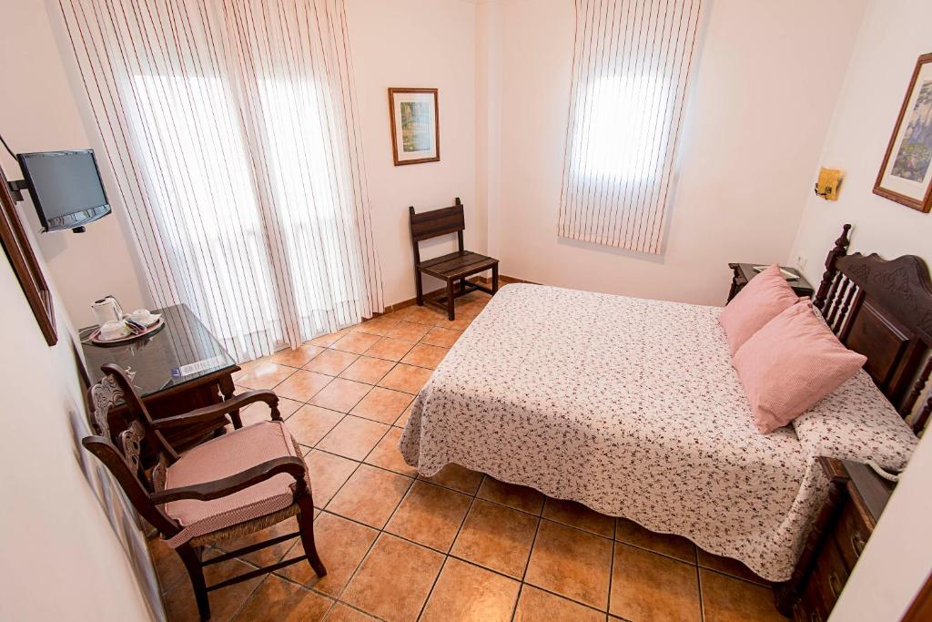 Postel nebo postele na pokoji v ubytování Hostal Marissal by Dorobe