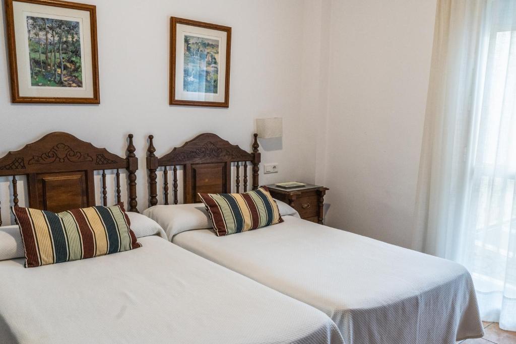 Postel nebo postele na pokoji v ubytování Hostal Marissal by Dorobe