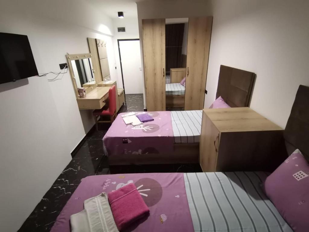 Postel nebo postele na pokoji v ubytování HOTEL EMA