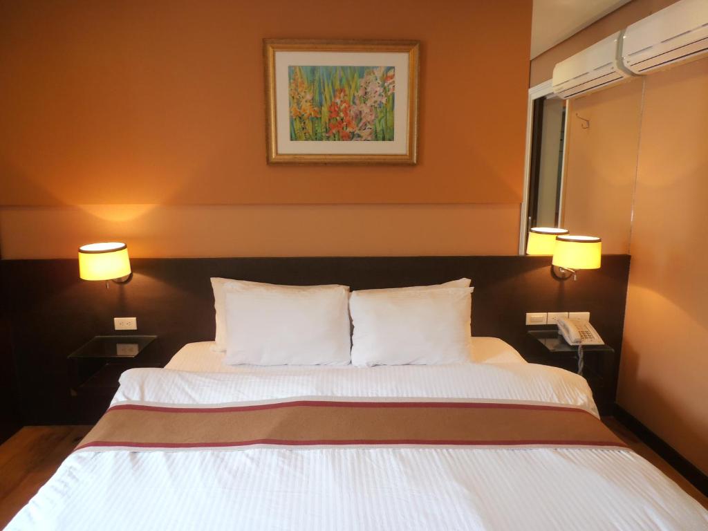 Postel nebo postele na pokoji v ubytování Ciudad Fernandina Hotel