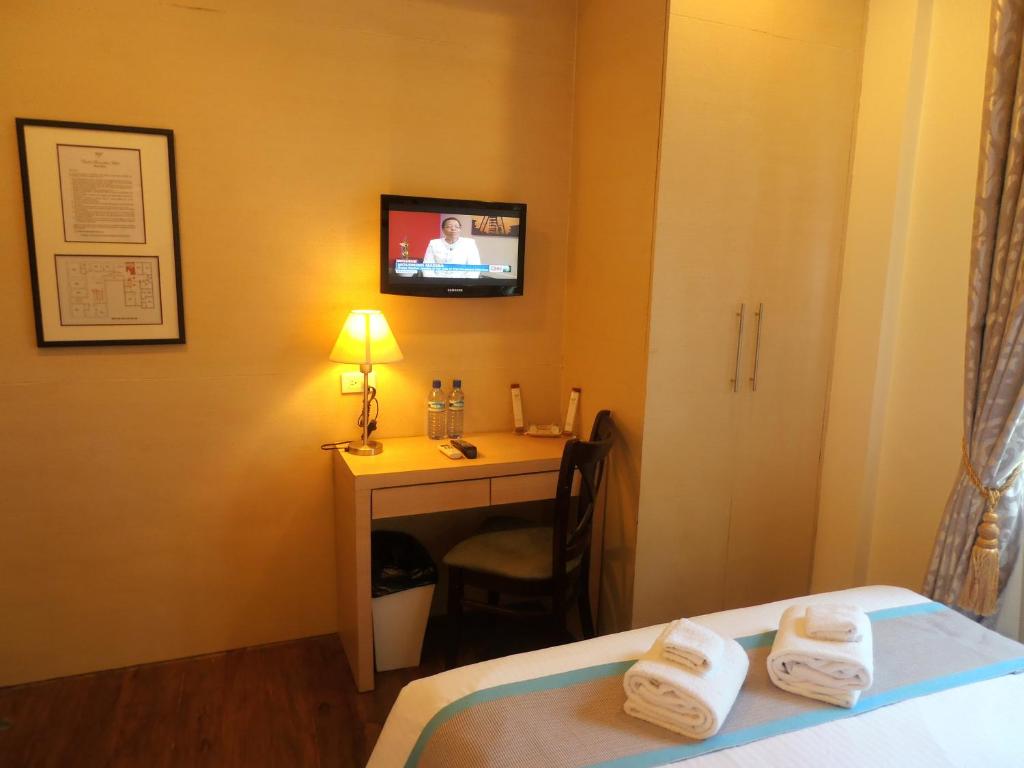 Postel nebo postele na pokoji v ubytování Ciudad Fernandina Hotel