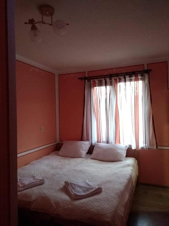 Postel nebo postele na pokoji v ubytování Тороманова къща
