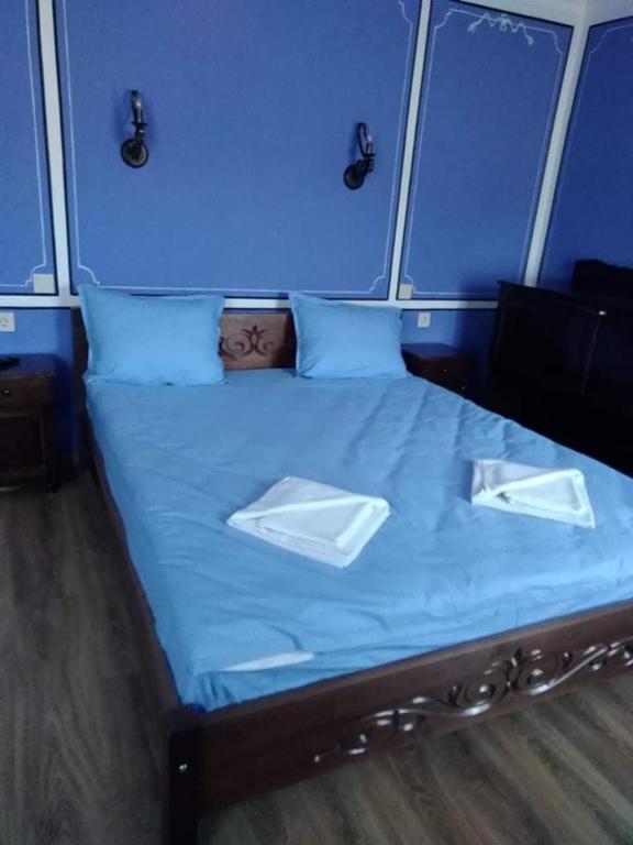 Postel nebo postele na pokoji v ubytování Тороманова къща