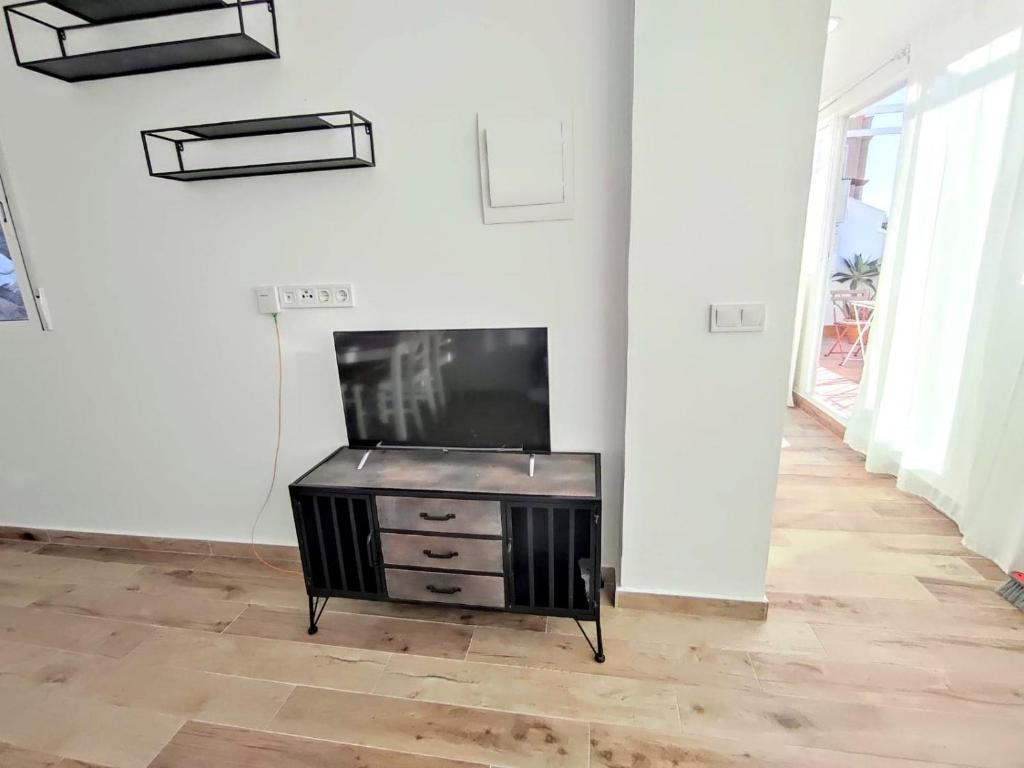 Televízia a/alebo spoločenská miestnosť v ubytovaní La Terraza de Salomon ApartamentosMalagaManagement