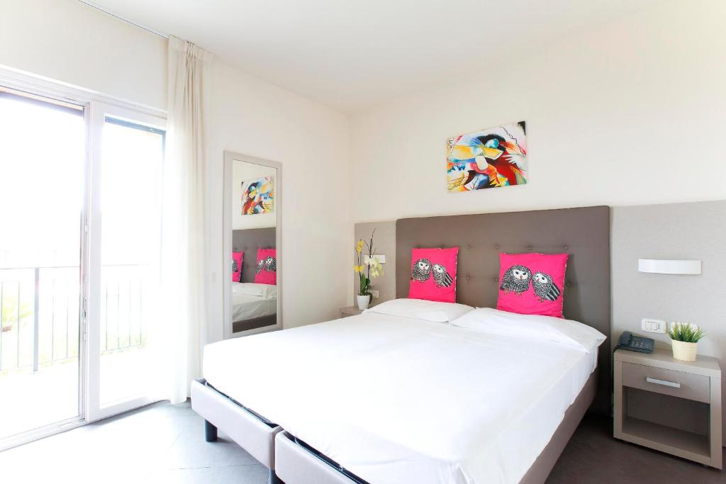 Postel nebo postele na pokoji v ubytování Hotel Belvedere