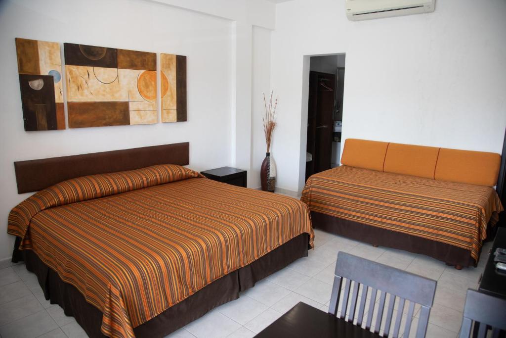 Krevet ili kreveti u jedinici u okviru objekta Aparthotel Siete 32