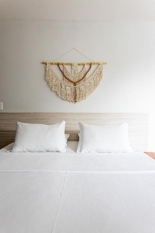Postel nebo postele na pokoji v ubytování Pousada Casa da Praia Angra
